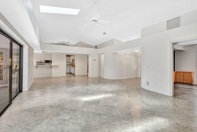 2101 SE Harlow St, Port Saint Lucie, FL 34952 - unfurnished living room featuring a skylight, ceiling fan, baseboards, visible vents, and high vaulted ceiling