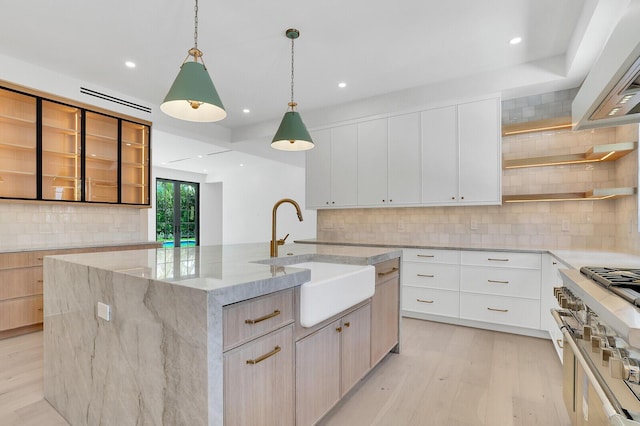 3408 Washington Rd, West Palm Beach, FL 33405 - kitchen with open shelves, range with two ovens, a sink, modern cabinets, and backsplash
