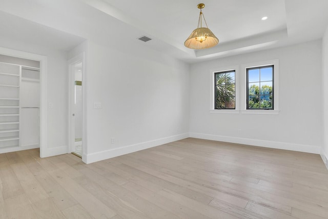 3408 Washington Rd, West Palm Beach, FL 33405 - unfurnished bedroom featuring light wood finished floors, a tray ceiling, baseboards, recessed lighting, and a closet