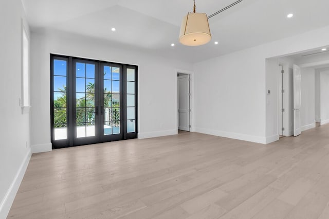 3408 Washington Rd, West Palm Beach, FL 33405 - empty room featuring light wood finished floors, french doors, recessed lighting, and baseboards