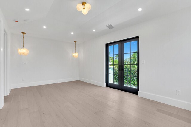 3408 Washington Rd, West Palm Beach, FL 33405 - unfurnished room featuring french doors, light wood finished floors, baseboards, and recessed lighting