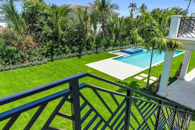 3408 Washington Rd, West Palm Beach, FL 33405 - view of swimming pool featuring a yard, a patio area, and a pool with connected hot tub