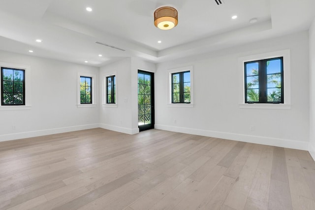 3408 Washington Rd, West Palm Beach, FL 33405 - empty room with a raised ceiling, light wood-type flooring, baseboards, recessed lighting, and a smoke detector