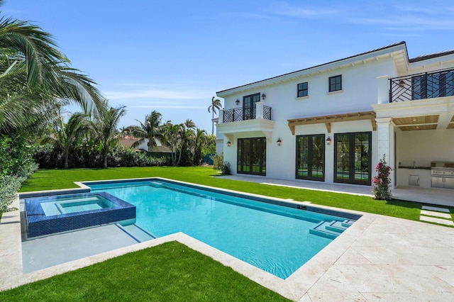 3408 Washington Rd, West Palm Beach, FL 33405 - view of swimming pool featuring a patio, a yard, french doors, and a pool with connected hot tub