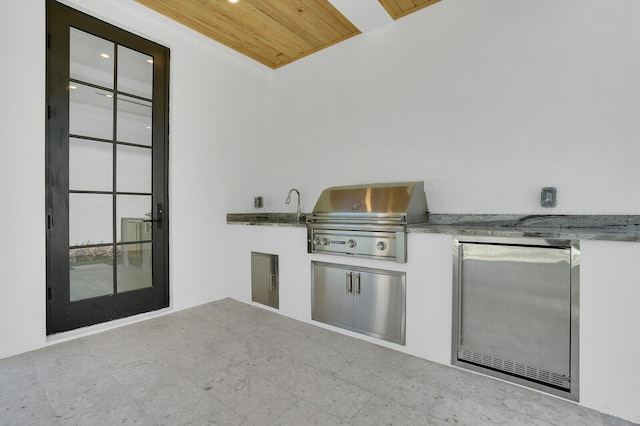 3408 Washington Rd, West Palm Beach, FL 33405 - view of patio featuring a grill and an outdoor kitchen