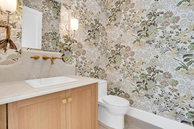 3408 Washington Rd, West Palm Beach, FL 33405 - half bath with wallpapered walls, toilet, and vanity