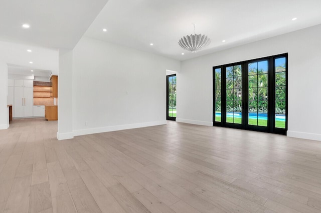 3408 Washington Rd, West Palm Beach, FL 33405 - empty room with recessed lighting, light wood finished floors, and baseboards
