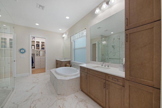 4673 Estates Cir, Westlake, FL 33470 - bathroom with a marble finish shower, marble finish flooring, a bath, two vanities, and recessed lighting