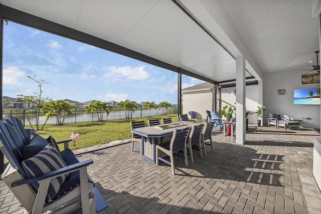 4673 Estates Cir, Westlake, FL 33470 - view of patio with a water view, outdoor dining area, and a ceiling fan