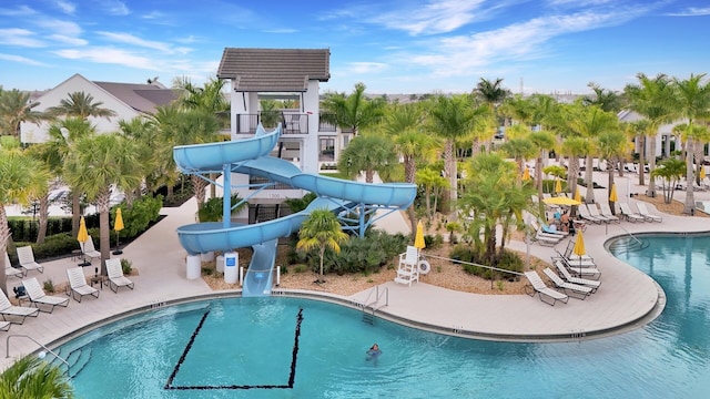 4673 Estates Cir, Westlake, FL 33470 - community pool featuring a water slide and a patio