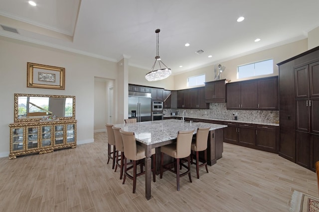 4673 Estates Cir, Westlake, FL 33470 - dining area featuring ornamental molding, light wood-type flooring, baseboards, and recessed lighting