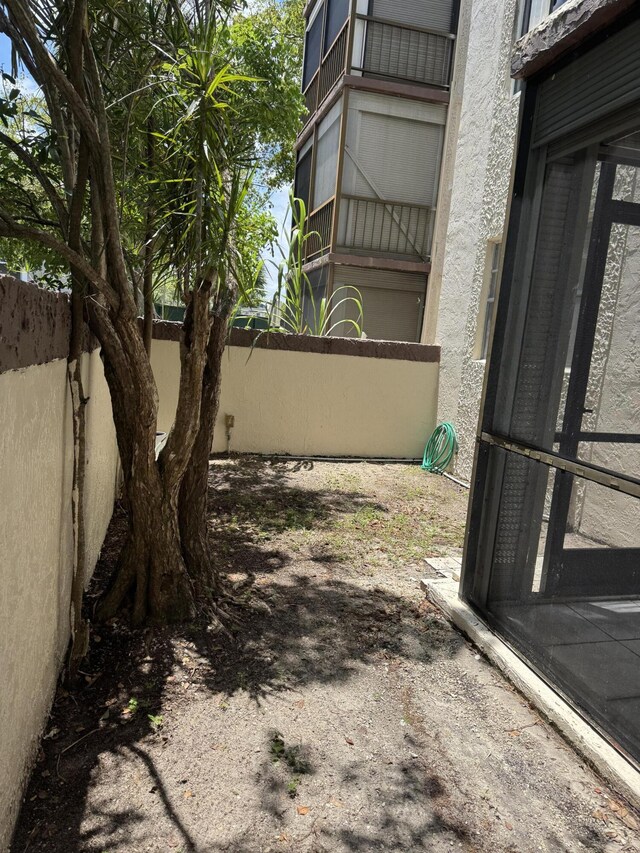 1681 NW 70th Ave Unit 102, Plantation, FL 33313 - view of yard featuring fence