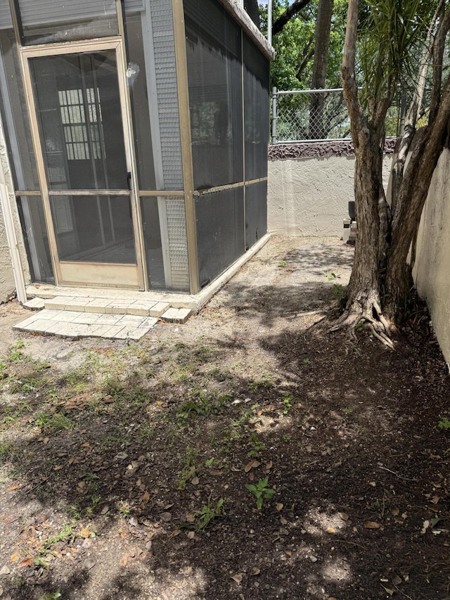 1681 NW 70th Ave Unit 102, Plantation, FL 33313 - view of outdoor structure with fence and a sunroom