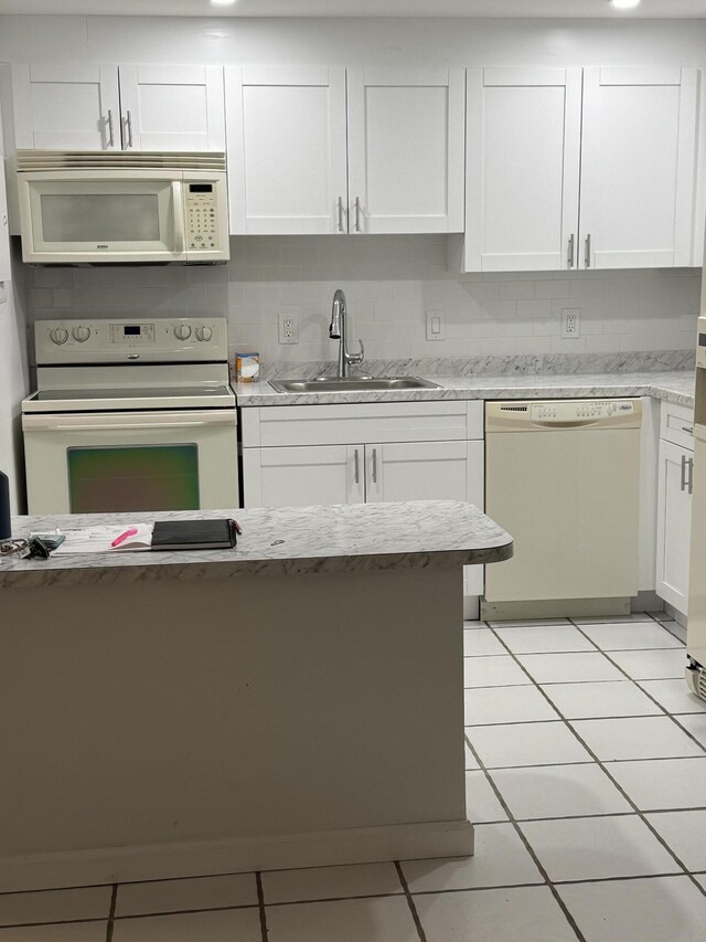 1681 NW 70th Ave Unit 102, Plantation, FL 33313 - spare room featuring a ceiling fan, baseboards, wood finished floors, and a textured ceiling