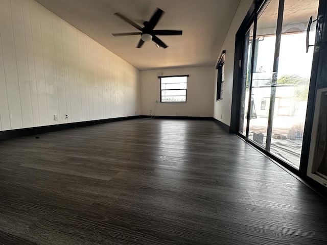 2379 Carambola Rd, West Palm Beach, FL 33406 - empty room featuring baseboards, ceiling fan, and dark wood-style flooring