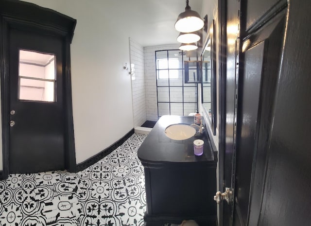 2379 Carambola Rd, West Palm Beach, FL 33406 - hallway featuring a sink and baseboards