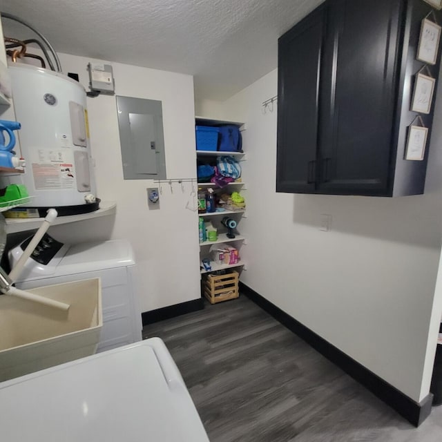 2379 Carambola Rd, West Palm Beach, FL 33406 - washroom with cabinet space, water heater, separate washer and dryer, wood finished floors, and baseboards