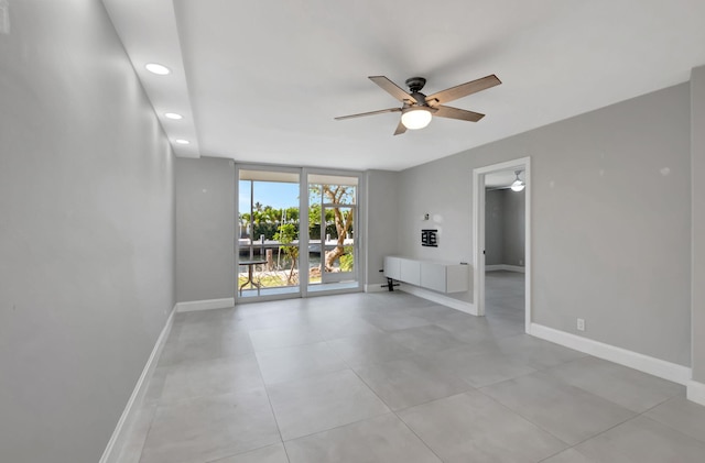 unfurnished living room with recessed lighting, baseboards, and ceiling fan