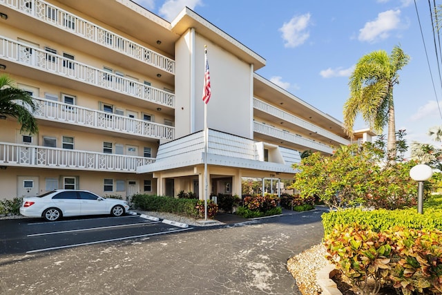 view of property with uncovered parking