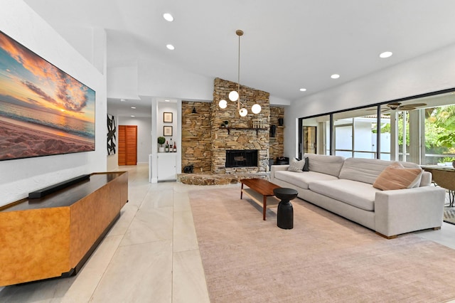 living area featuring high vaulted ceiling, light tile patterned floors, ceiling fan, a fireplace, and recessed lighting