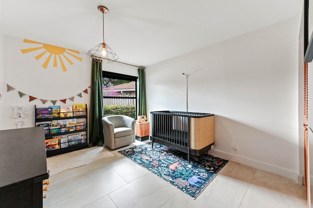 bedroom featuring baseboards and tile patterned flooring