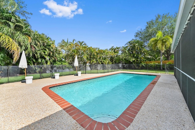 view of swimming pool with fence and a fenced in pool