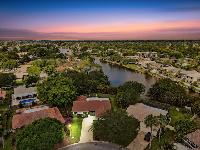 bird's eye view featuring a water view and a residential view