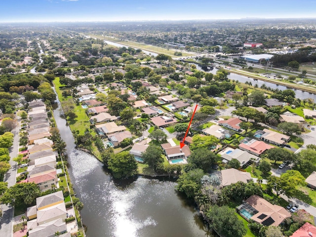 birds eye view of property featuring a residential view and a water view