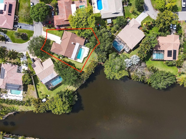 drone / aerial view with a residential view and a water view