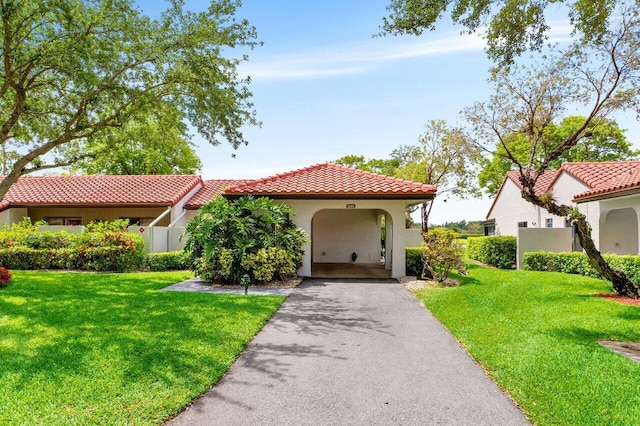 21481 Cypress Hammock Dr Unit 31B, Boca Raton, FL 33428 - mediterranean / spanish-style home featuring stucco siding, a front lawn, driveway, and a tile roof