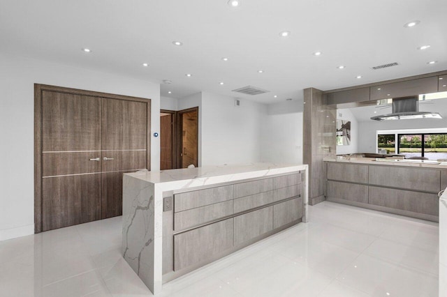 21481 Cypress Hammock Dr Unit 31B, Boca Raton, FL 33428 - kitchen with light stone counters, modern cabinets, recessed lighting, and visible vents