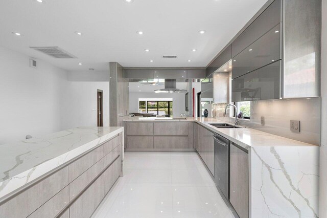 21481 Cypress Hammock Dr Unit 31B, Boca Raton, FL 33428 - kitchen featuring a sink, light stone counters, and modern cabinets