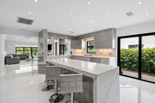 21481 Cypress Hammock Dr Unit 31B, Boca Raton, FL 33428 - kitchen featuring a sink, dishwasher, light tile patterned floors, visible vents, and modern cabinets