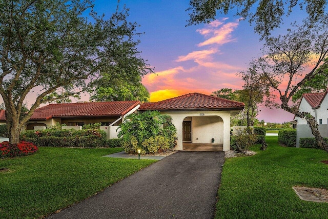 21481 Cypress Hammock Dr Unit 31B, Boca Raton, FL 33428 - mediterranean / spanish home featuring a lawn, stucco siding, driveway, and a tile roof