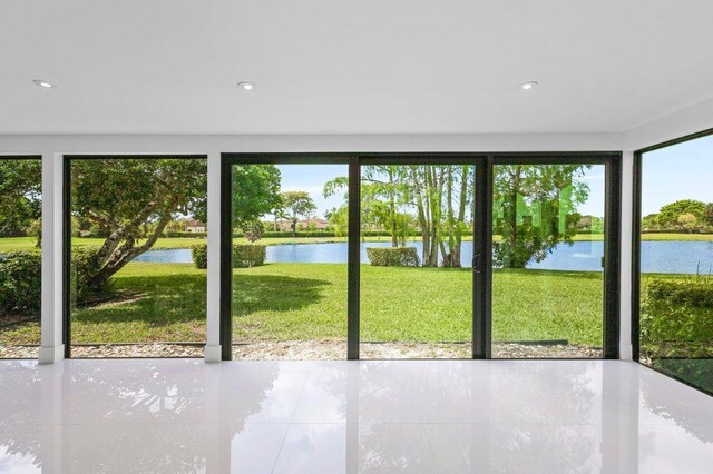21481 Cypress Hammock Dr Unit 31B, Boca Raton, FL 33428 - unfurnished sunroom with a water view and a wealth of natural light