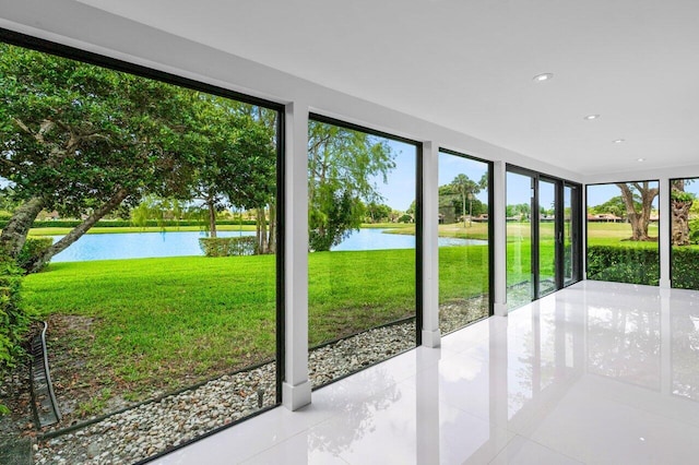 21481 Cypress Hammock Dr Unit 31B, Boca Raton, FL 33428 - unfurnished sunroom featuring tile patterned flooring, recessed lighting, and a water view