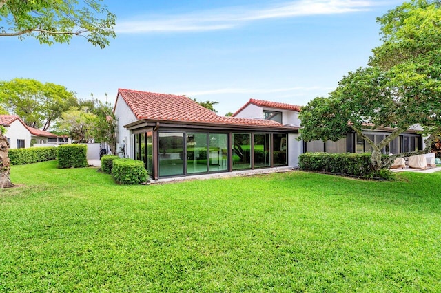 21481 Cypress Hammock Dr Unit 31B, Boca Raton, FL 33428 - back of house with stucco siding, a yard, and a tiled roof
