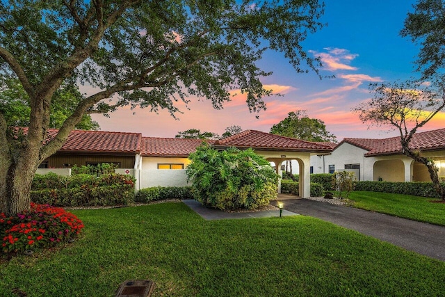 21481 Cypress Hammock Dr Unit 31B, Boca Raton, FL 33428 - mediterranean / spanish house featuring a lawn, stucco siding, and a tile roof