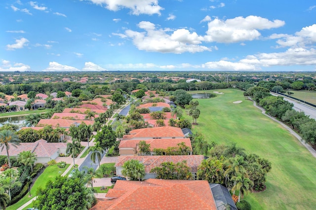 aerial perspective of suburban area with a large body of water and a golf club