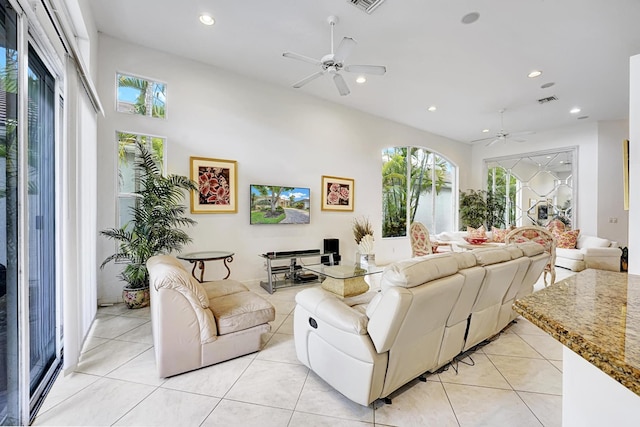 living room with a ceiling fan, light tile patterned floors, and recessed lighting