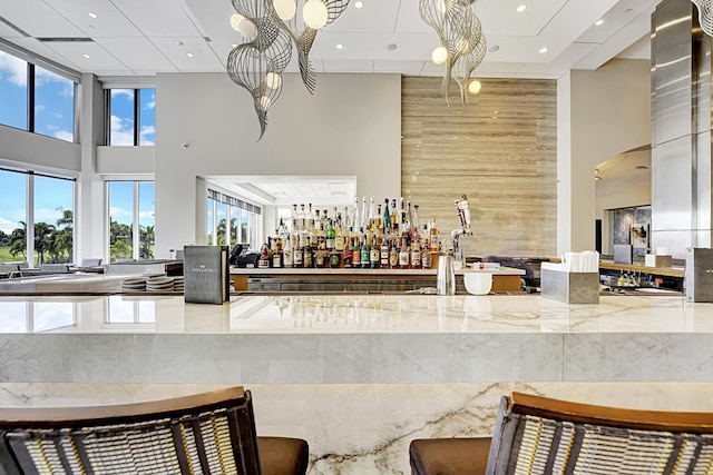 common area with a high ceiling and recessed lighting