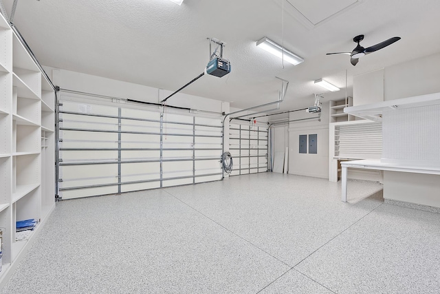 17065 Bay St, Jupiter, FL 33477 - garage with a ceiling fan, a garage door opener, and electric panel