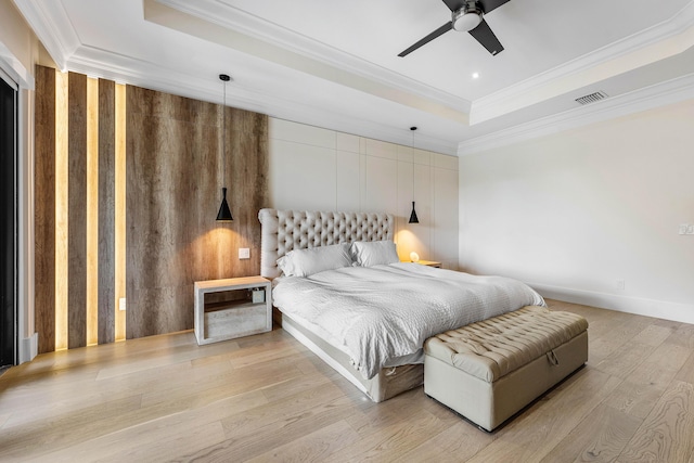 16491 Gateway Bridge Dr, Delray Beach, FL 33446 - bedroom featuring a raised ceiling, crown molding, wood finished floors, wooden walls, and a ceiling fan