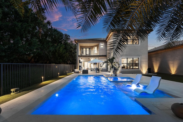 16491 Gateway Bridge Dr, Delray Beach, FL 33446 - pool at dusk with a patio