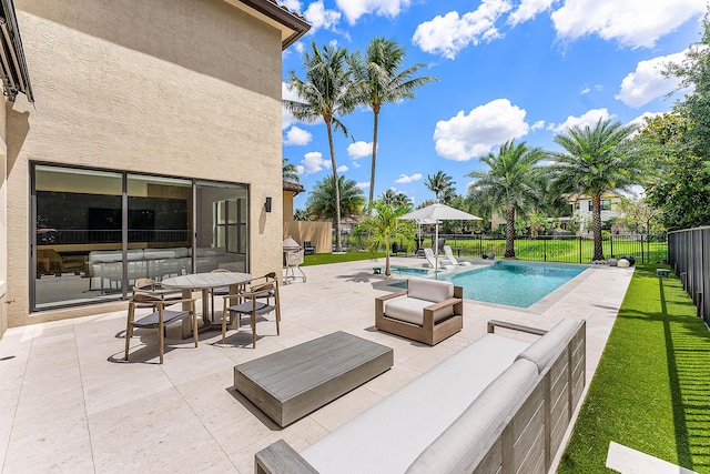 16491 Gateway Bridge Dr, Delray Beach, FL 33446 - view of swimming pool featuring a patio and an outdoor living space