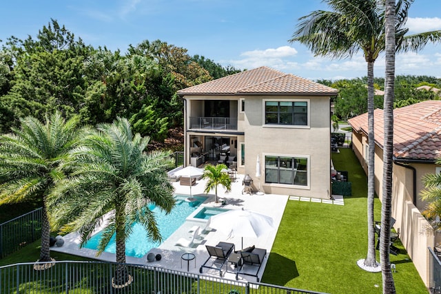 16491 Gateway Bridge Dr, Delray Beach, FL 33446 - rear view of house with a balcony, stucco siding, a patio area, a pool with connected hot tub, and a tile roof