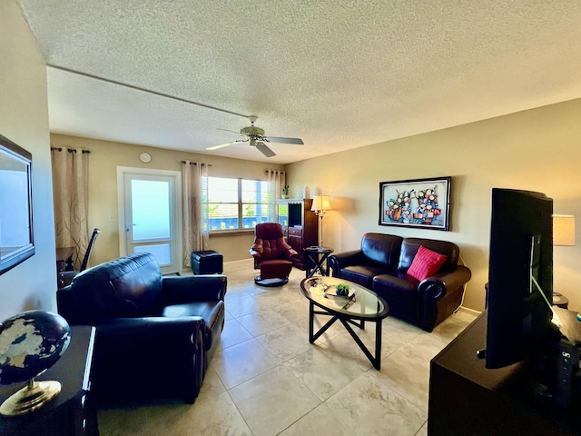 4015 Islewood D, Deerfield Beach, FL 33442 - living room featuring a textured ceiling and ceiling fan