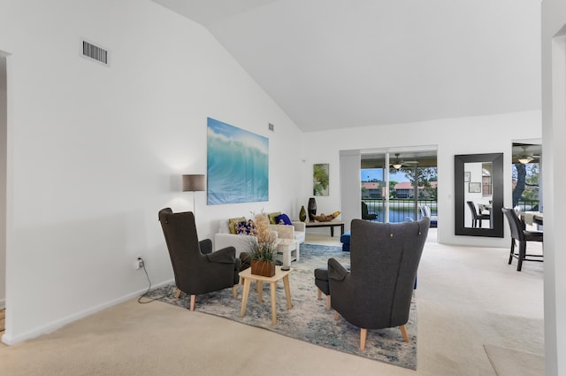 9927 Seacrest Cir Unit 202, Boynton Beach, FL 33437 - living area with visible vents, a ceiling fan, baseboards, high vaulted ceiling, and carpet flooring