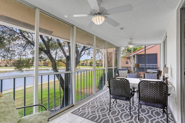 9927 Seacrest Cir Unit 202, Boynton Beach, FL 33437 - sunroom with outdoor dining area, a ceiling fan, and a water view