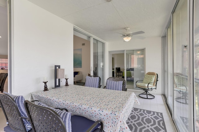 9927 Seacrest Cir Unit 202, Boynton Beach, FL 33437 - sunroom with ceiling fan and outdoor dining space